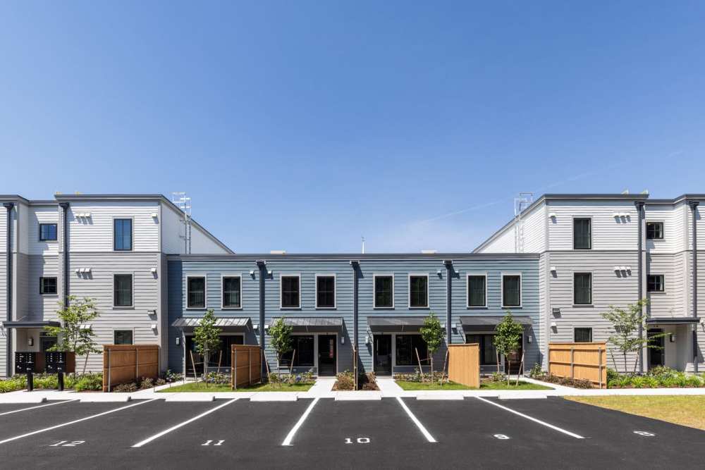 A view of a community with accessible parking spaces at One Neighborhood Builders in Providence, Rhode Island