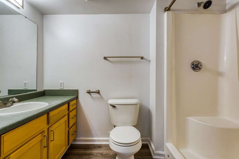 Bathroom with vanity and bathtub at Boomer Creek Apartments in Stillwater, Oklahoma