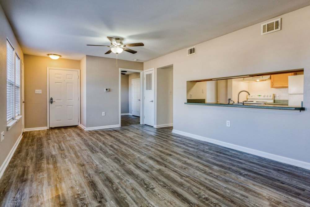 Unfurnished living room with wood-style flooring at Boomer Creek Apartments in Stillwater, Oklahoma