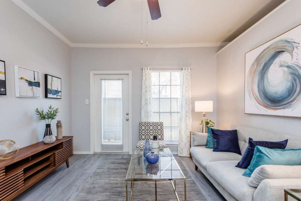 Living room with couch and coffee table at Green Tree Place in Houston, Texas