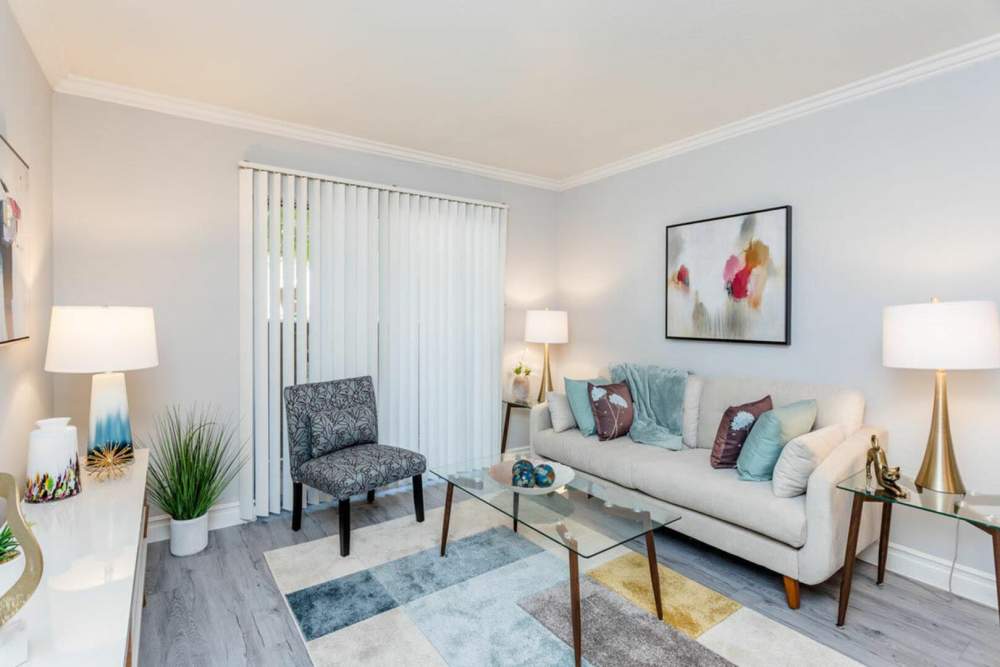 Living room with a couch and glass table at Ridge Point in Houston, Texas