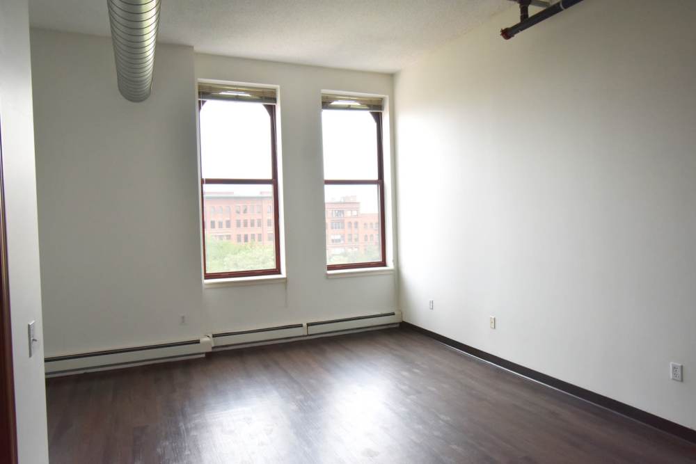 Empty room with two large windows at Straus Lofts in Saint Paul, Minnesota
