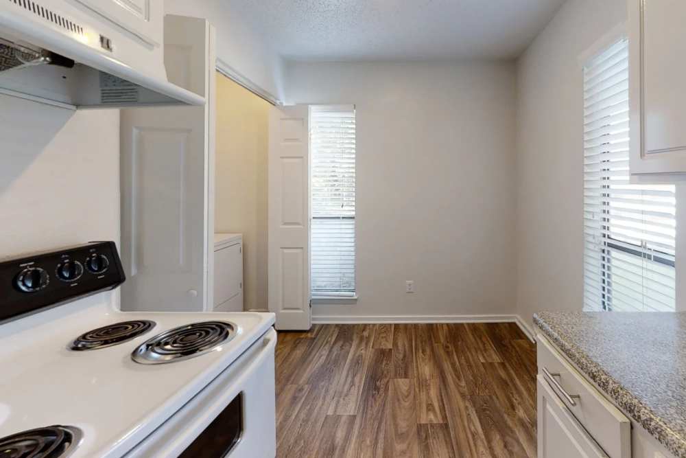 Kitchen with wood flooring at Andover at Crabtree in Raleigh. NC