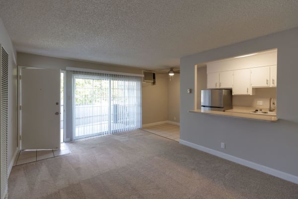 Living room with balcony at Catalina Crest Apartment Homes in Livermore, California