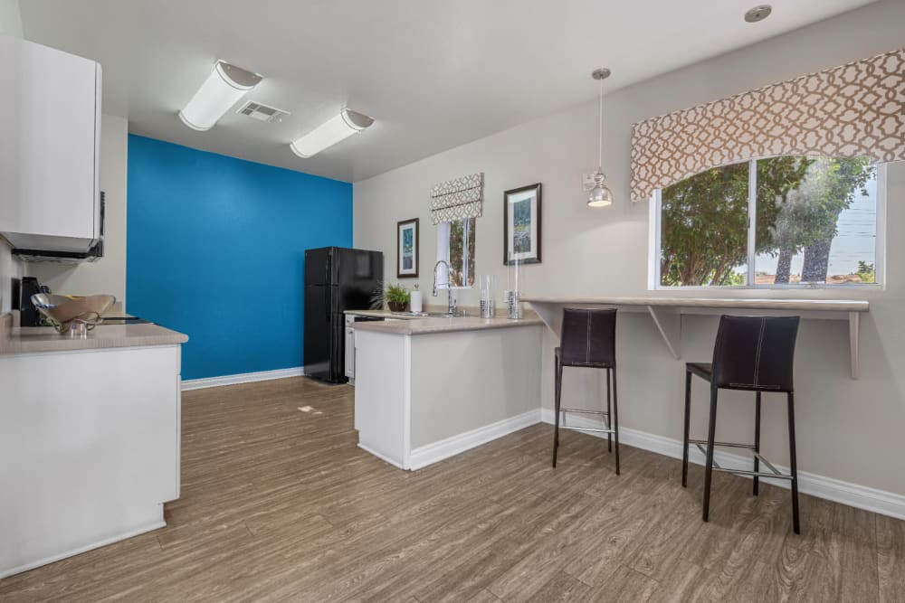 Community kitchen with bar stools at Alante at the Islands in Chandler, Arizona
