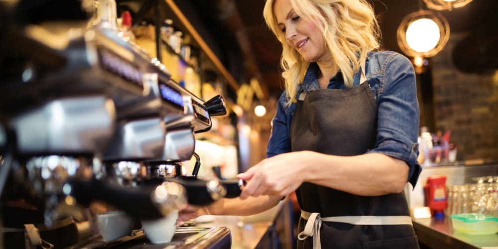 Resident working at a coffee shop near Apex Apartments in Arlington, Virginia