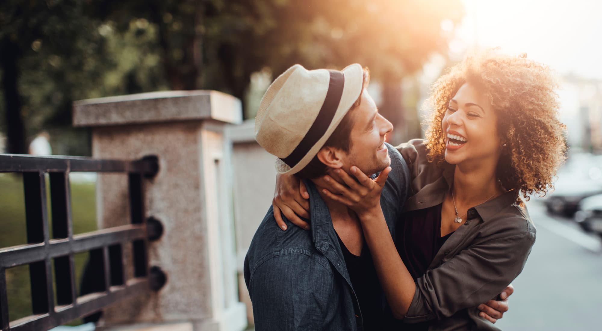Resident friends hugging each other at The Chateau Apartments in Mountain View, California