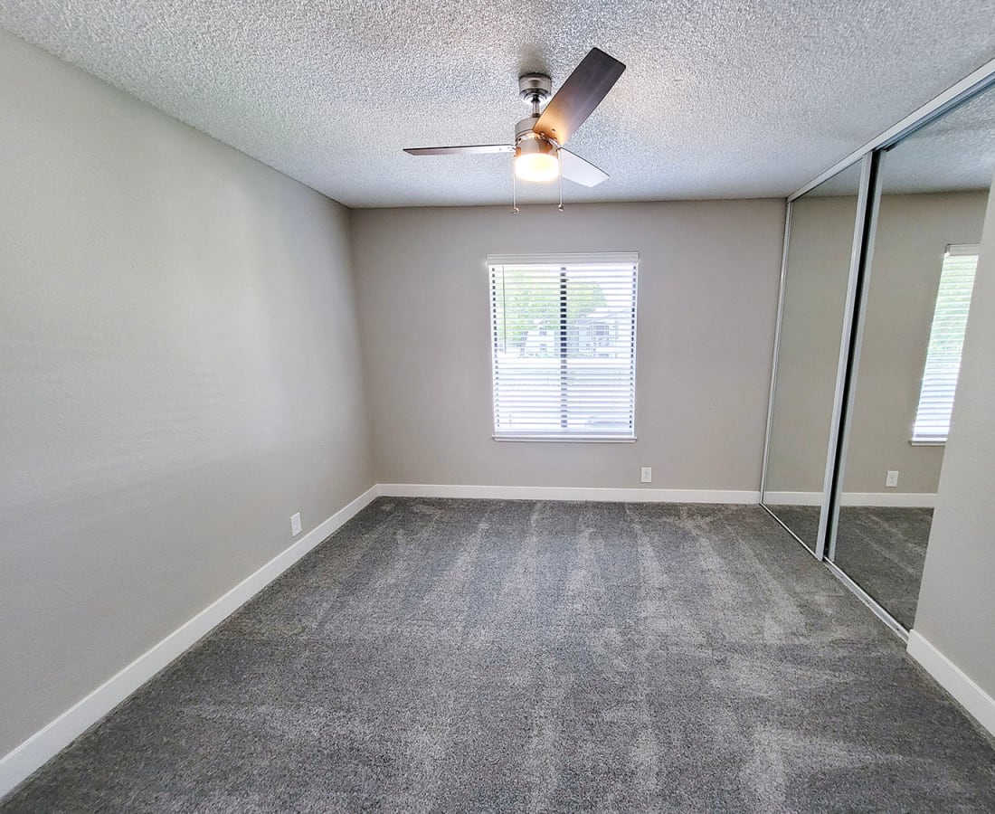 Bedroom with ceiling fan at The Mews At Dixon Farms in Dixon, California