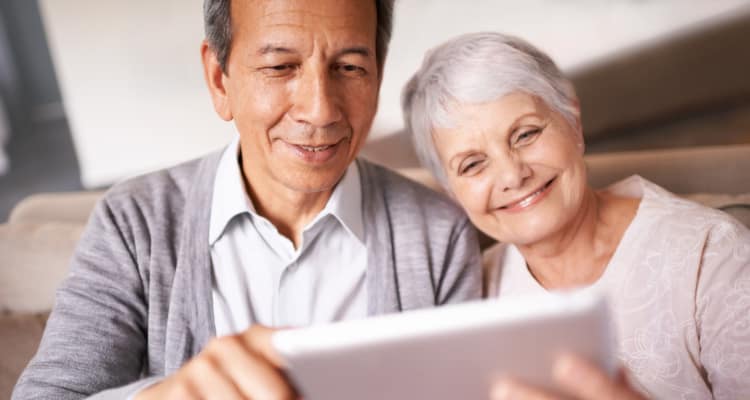 Senior and caregiver holding tablet at Maplewood at Chardon in Chardon, Ohio