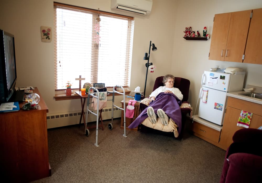 Resident relaxing in their private room at The Residences on Forest Lane in Montello, Wisconsin