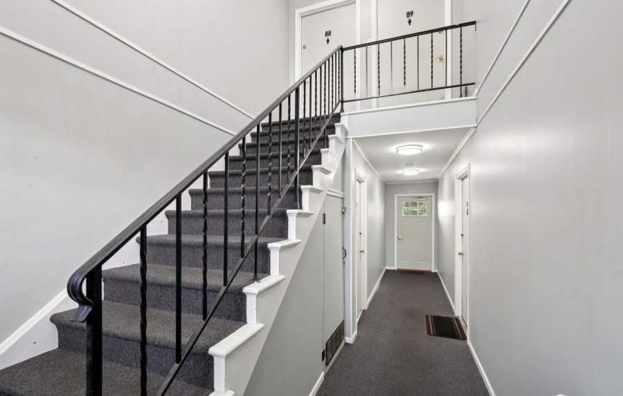 Carpet railing to upper level at Charleston Square Apartments in Columbus, Indiana