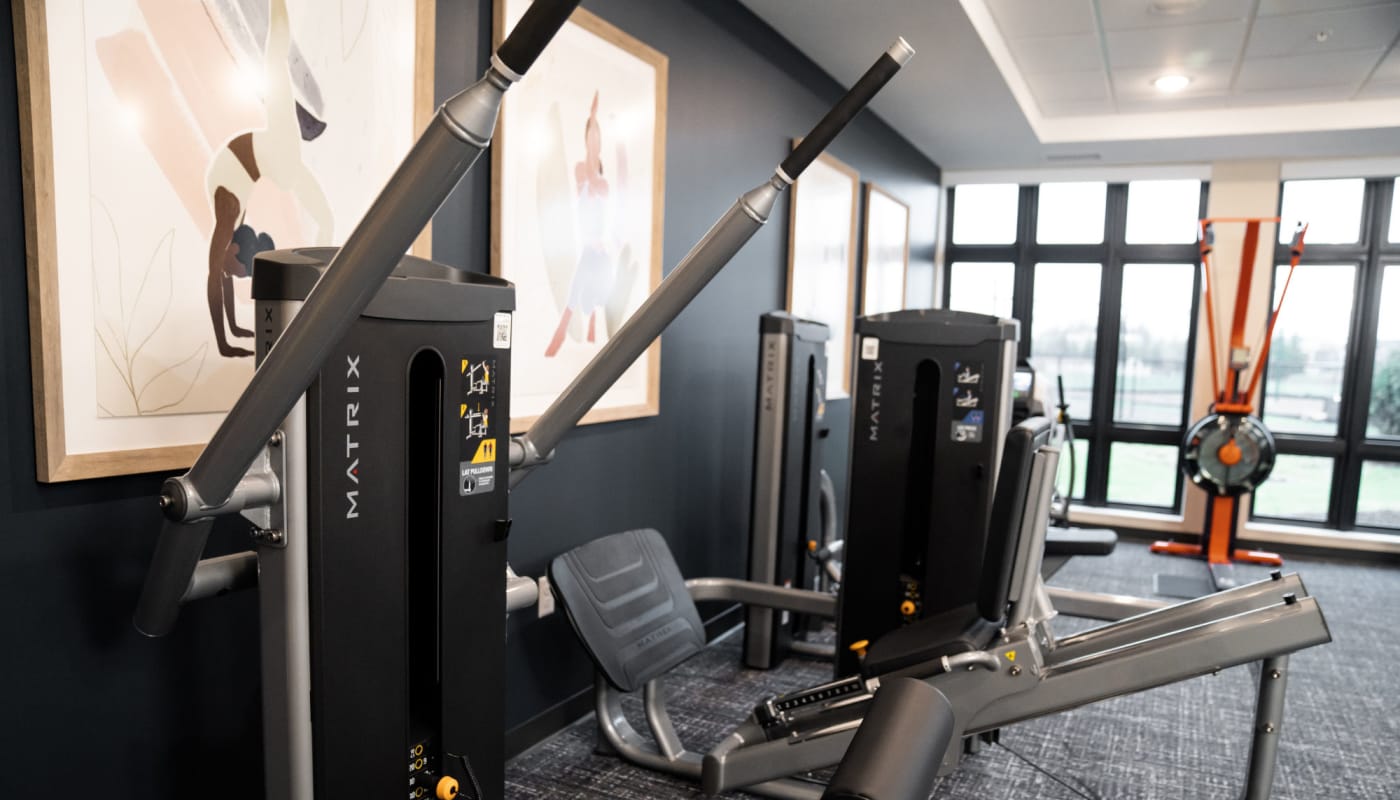 Community gym with weight machines at The Pillars of Lakeville in Lakeville, Minnesota