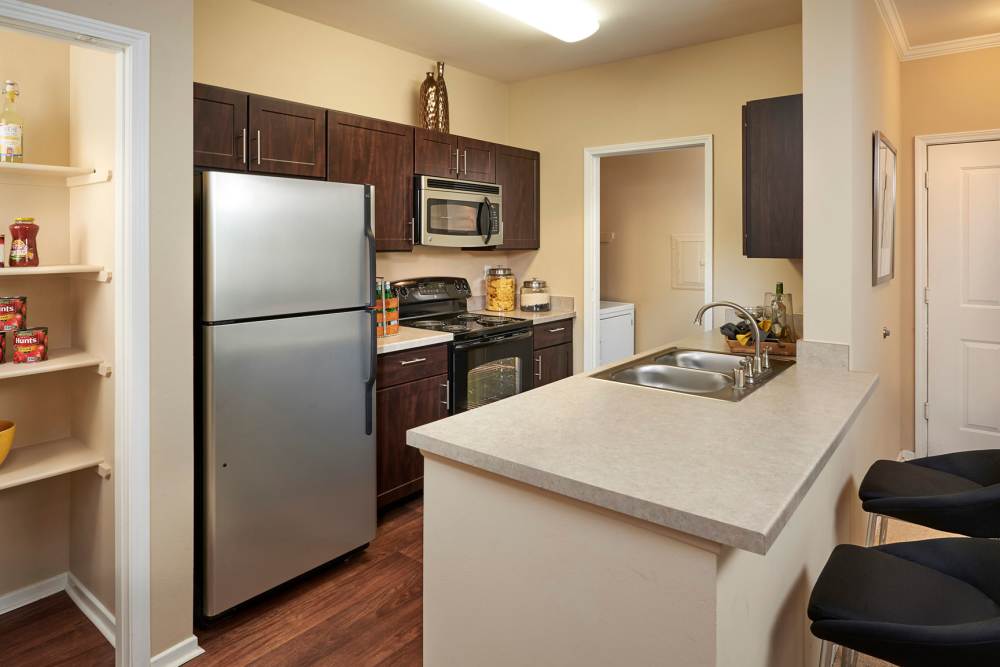 Cozy kitchen at Legend Oaks Apartments in Aurora, Colorado