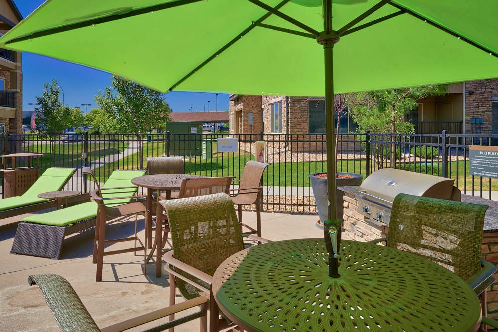 Outside barbeque area and seating area at M2 Apartments in  Denver, Colorado 