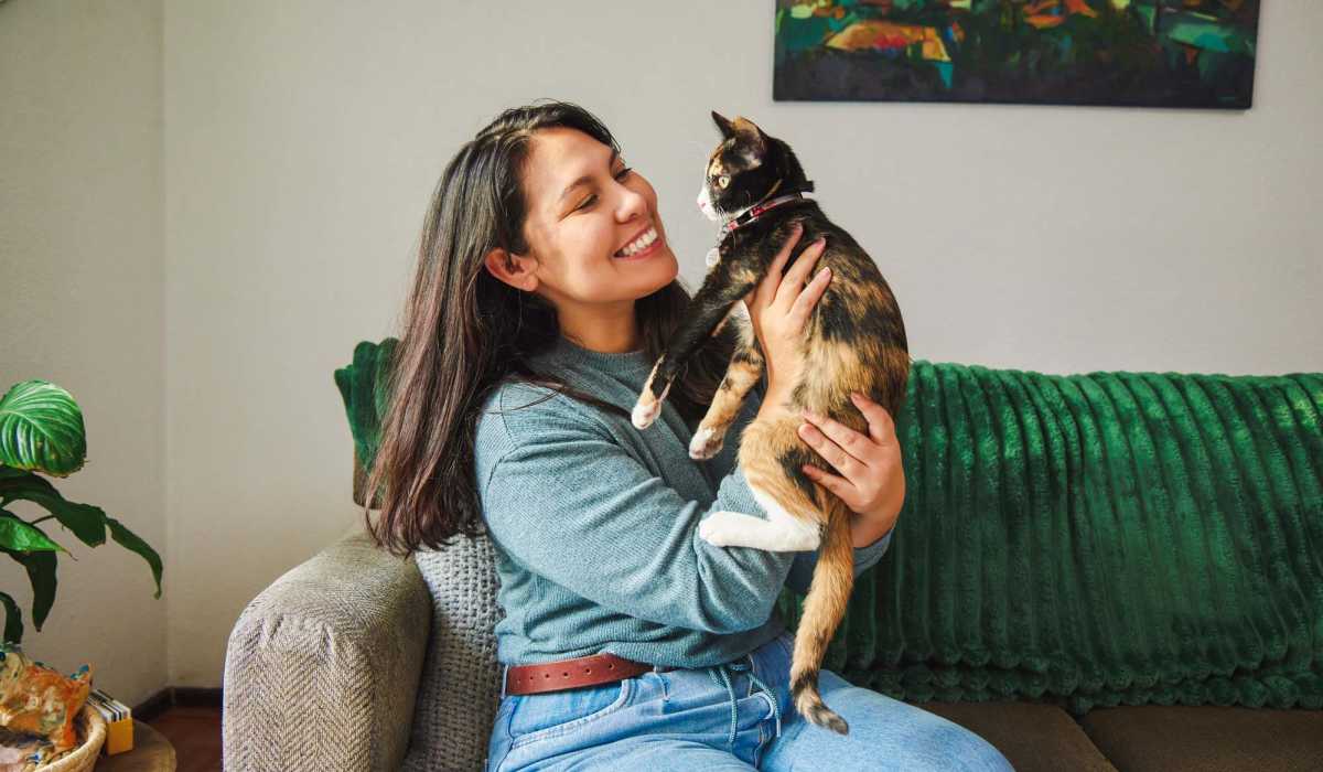 Resident playing with her cat at Mill Creek Apartments in Cross Plains, Wisconsin
