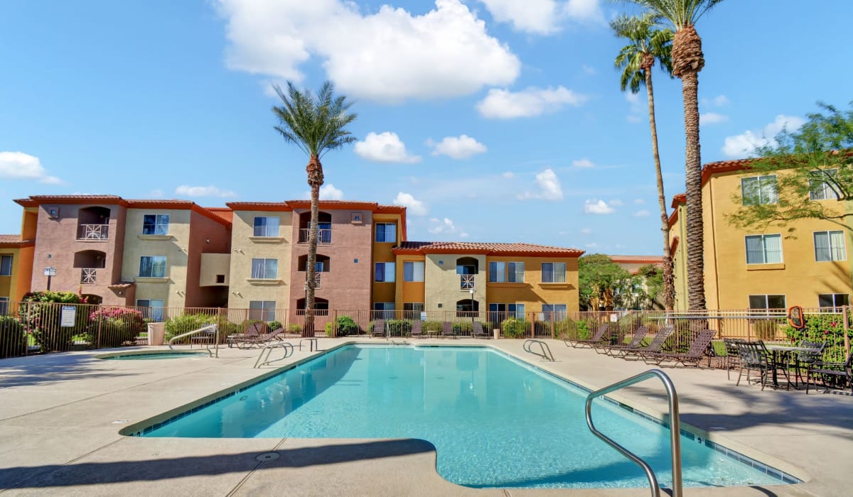 Swimming pool with pool side seating at La Serena at Toscana in Phoenix, Arizona 