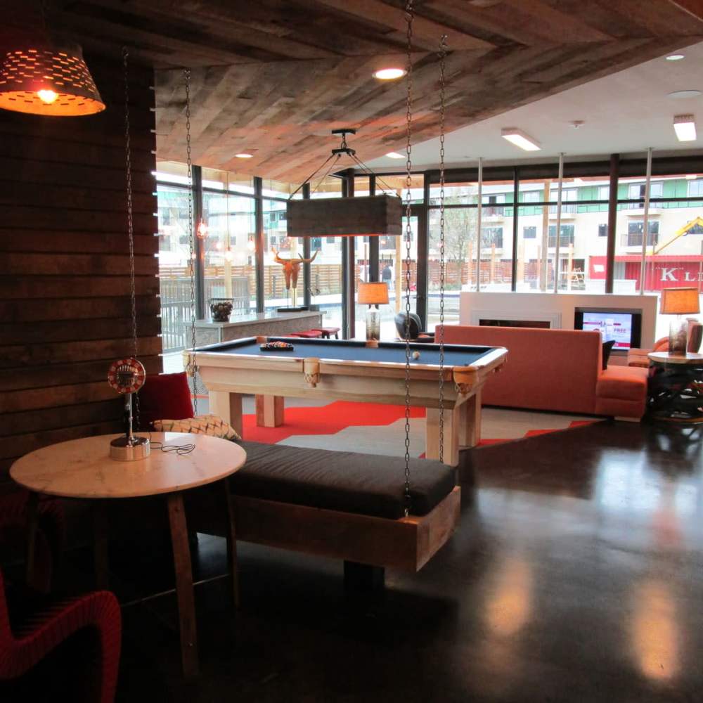 Recreational area in the clubhouse at Pike West Commerce in Dallas, Texas