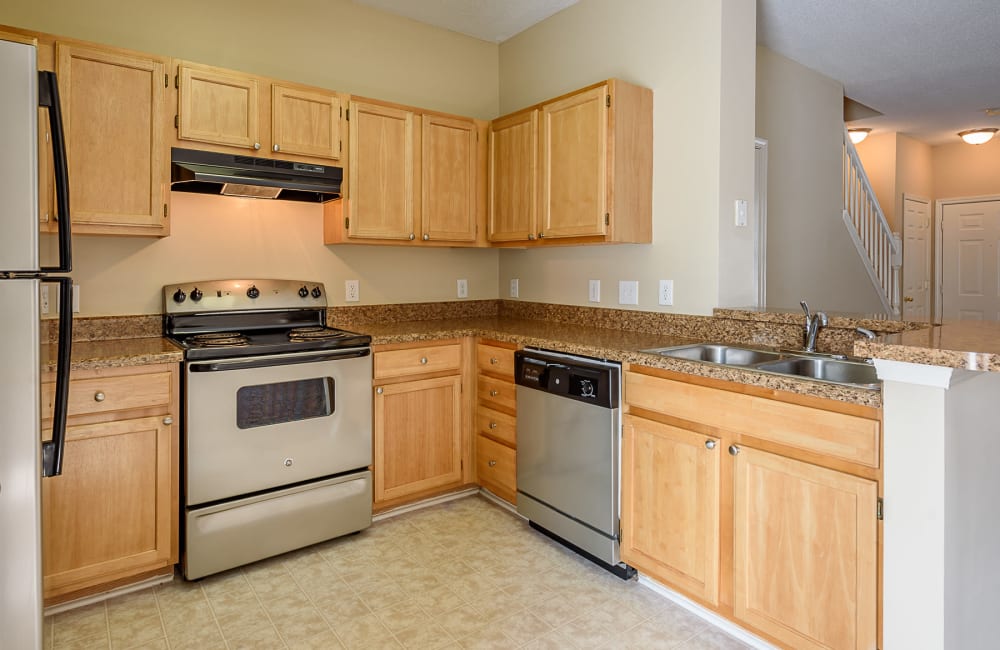 Fully equipped kitchen at Falls Creek Apartments & Townhomes in Raleigh, North Carolina