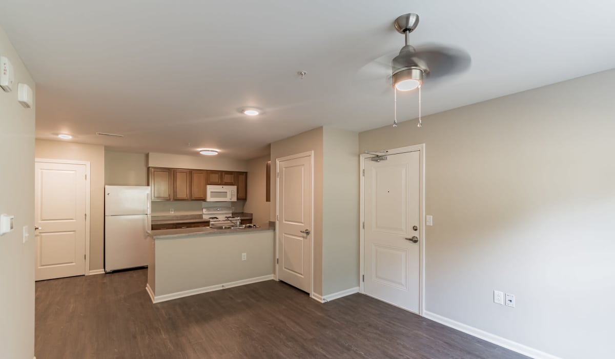 Living room with ceiling fan at Magnolia Greene in Lavale, Maryland