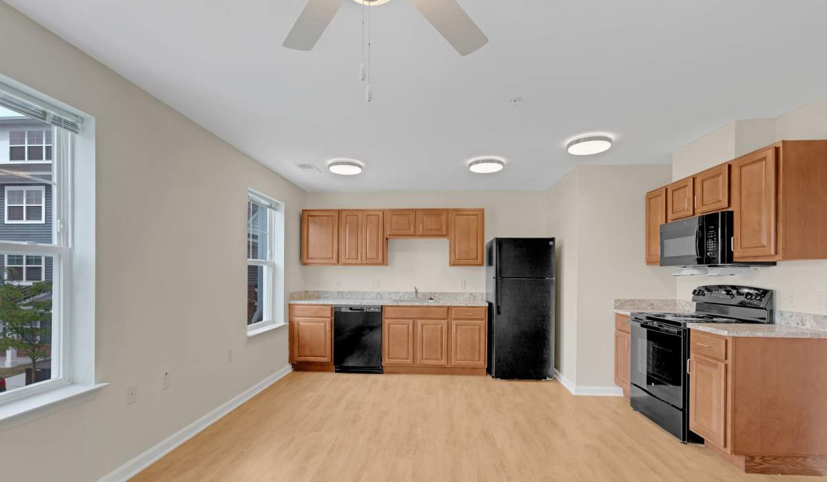 Kitchen with wood-style floors at Robinson Overlook in Columbia, Maryland