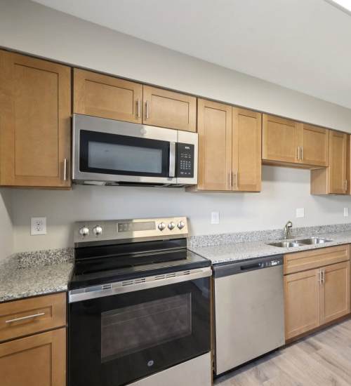 Kitchen with steel appliances at Charleston Square Apartments in Columbus, Indiana