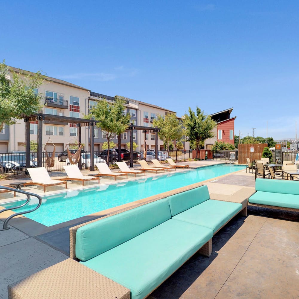 Lounge seating area near the pool on another gorgeous day at Oaks Trinity in Dallas, Texas