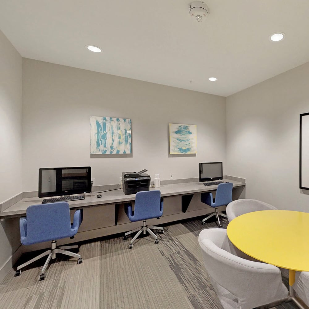 Business center with workstations for resident use at Oaks Trinity in Dallas, Texas