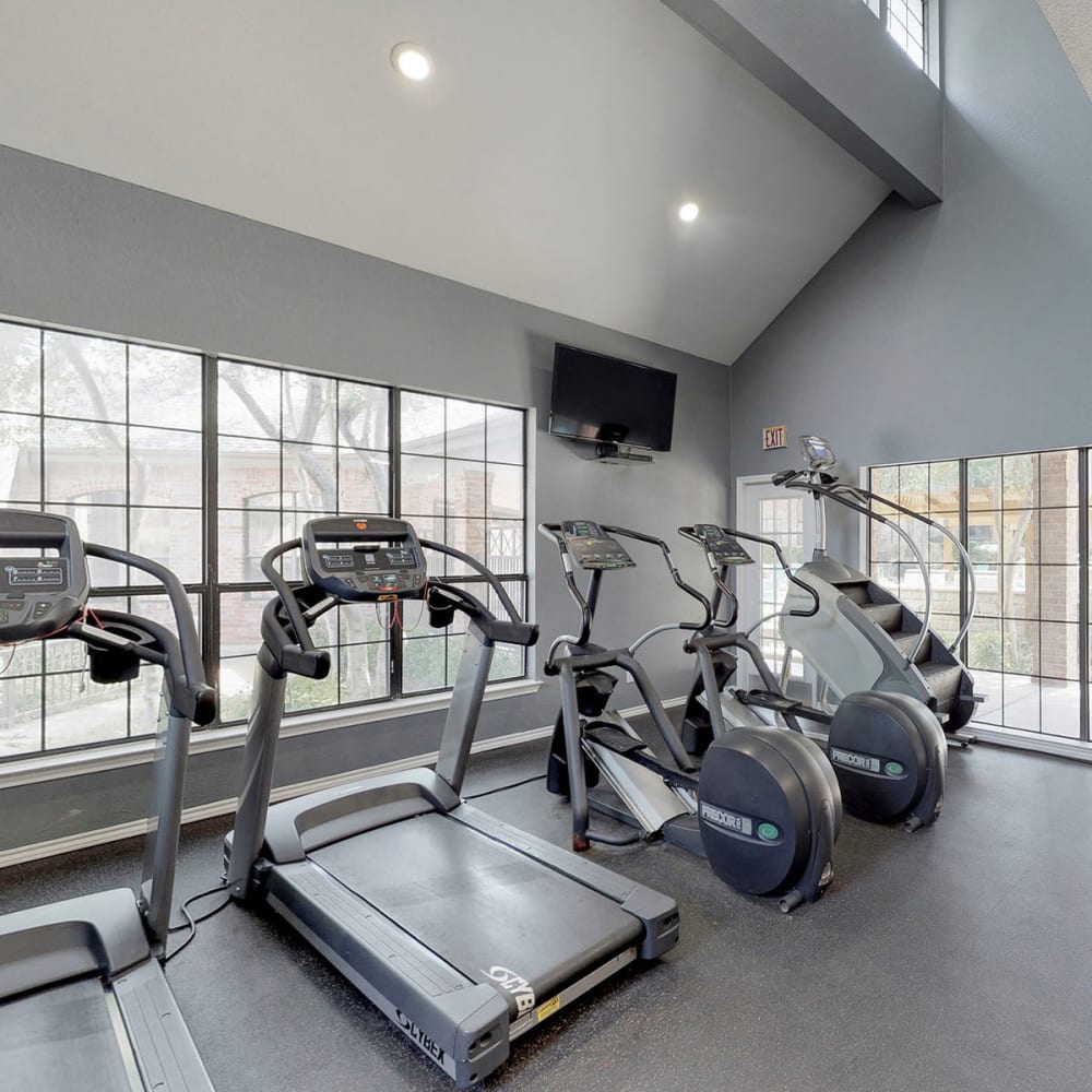 Treadmills and cardio equipment in the fitness center at Oaks Hackberry Creek in Las Colinas, Texas