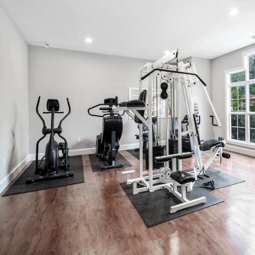 Community fitness center with cardio equipment at Brittany Place Hendersonville in Henderson, North Carolina