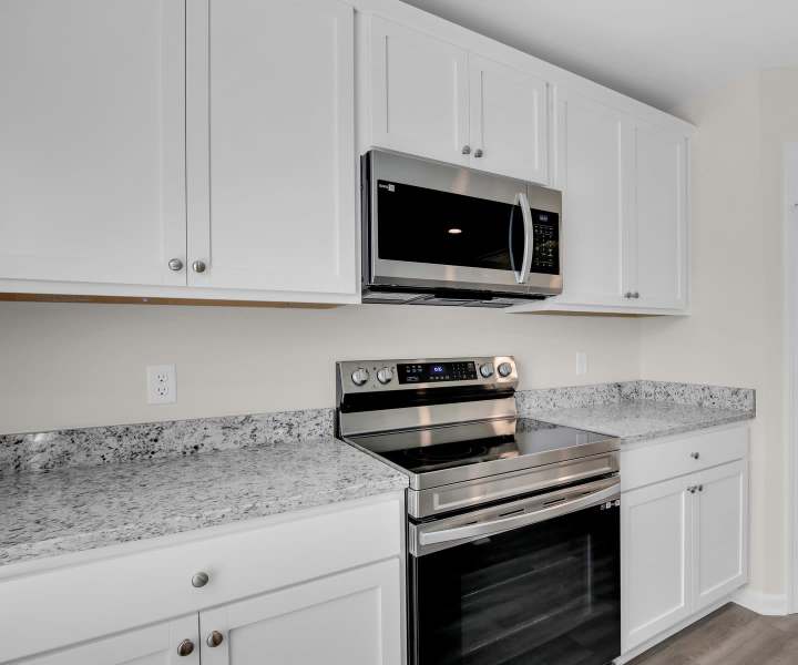 Kitchen of a modern apartment home at Hartford in Statesboro, Georgia