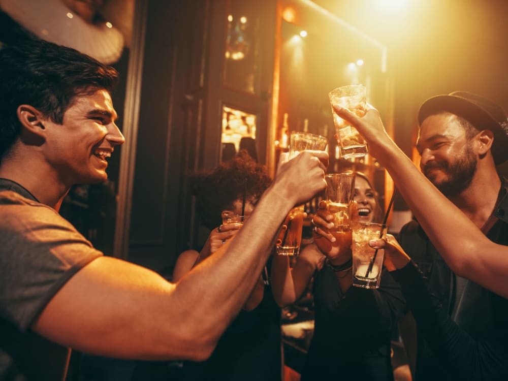 Resident friends raising a toast to the good life at a nightclub near Jade Apartments in Las Vegas, Nevada