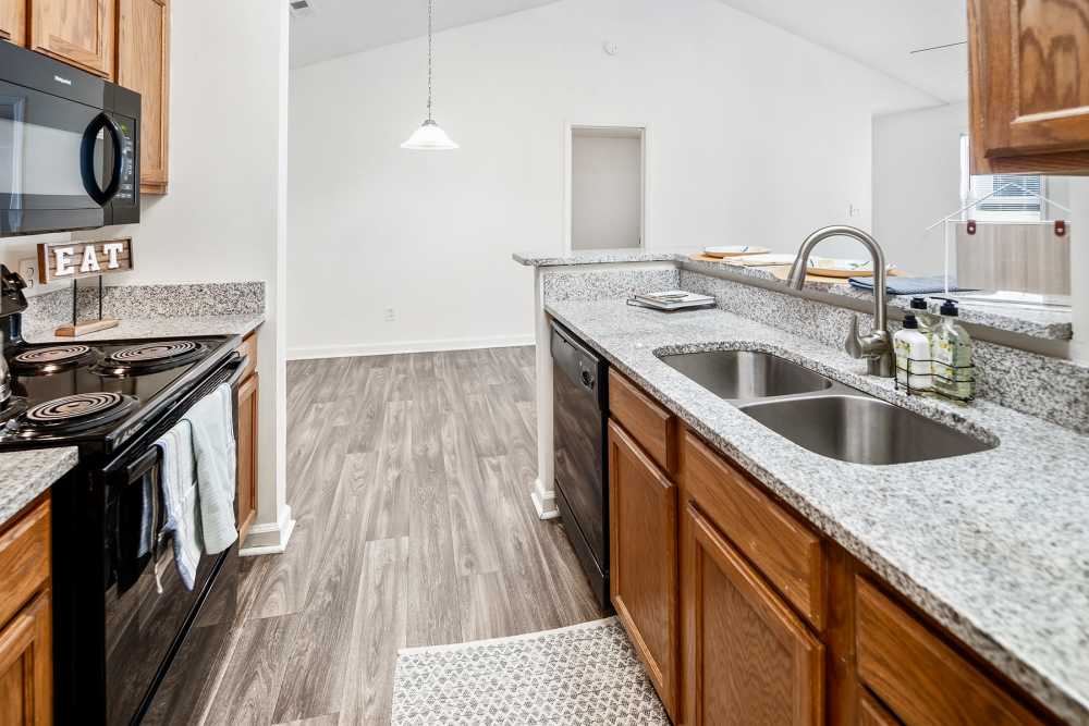 Stainless steel kitchen with appliances in a kitchen at Huntersville Commons in Huntersville, North Carolina