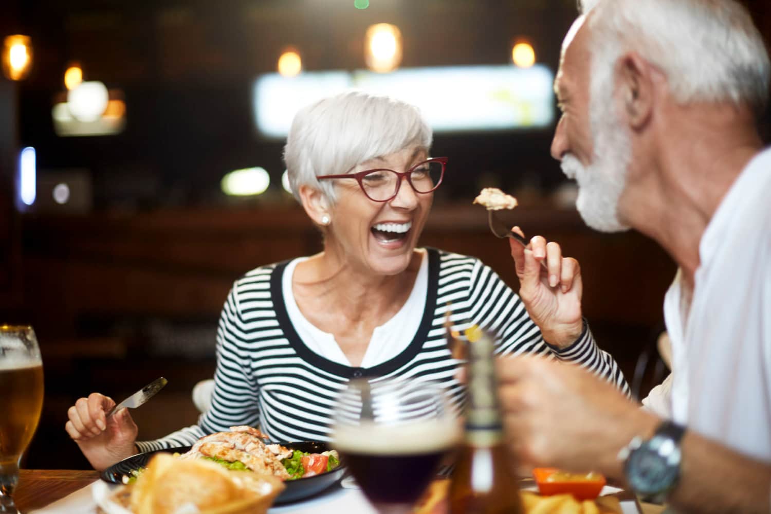 Happy residents in a cafe near Mill Pond Apartments (Buchanan) in Buchanan, Michigan