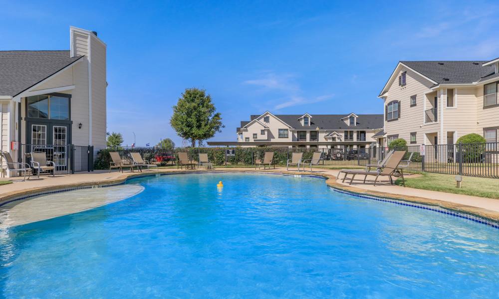 Pool area at Burkburnett Residences in Burkburnett, Texas