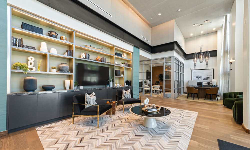 Premium clubhouse with chairs and a TV at Main and Mill in Lewisville,Texas