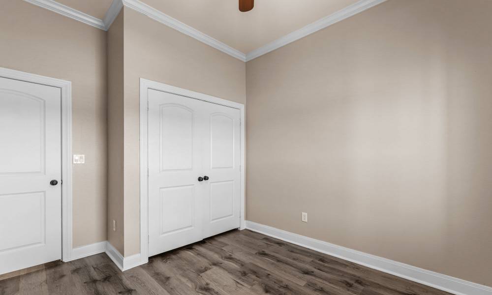 Bedroom with closets at The Arbors of Mineola in Mineola. TX