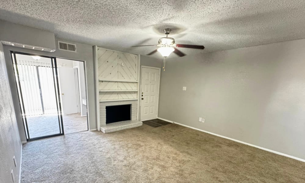 A fireplace in the living room at Santa Fe Apartments in Dallas, Texas