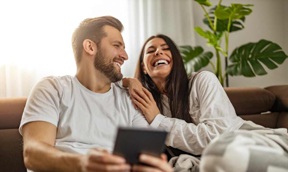 Happy resident couple in apartment at The Landing on 9 in Norman, Oklahoma
