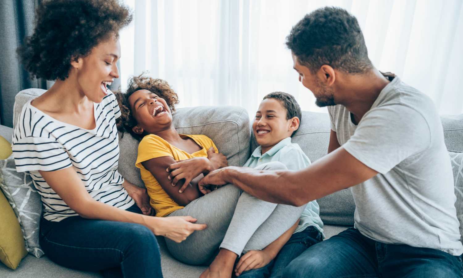 Happy family in apartment at The Carlton of Fort Myers in Fort Myers, Florida