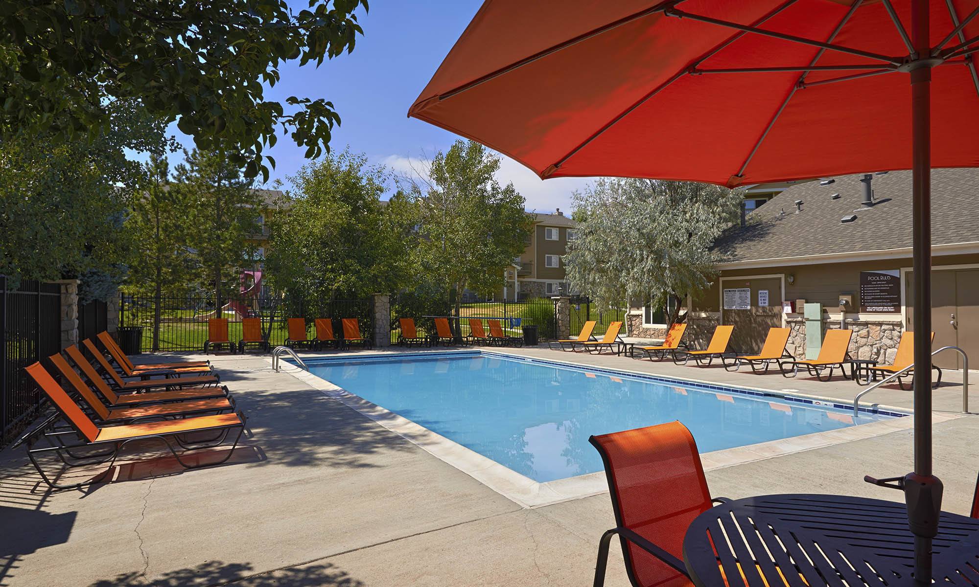 sparkling pool with lounge chairs in Aurora, CO