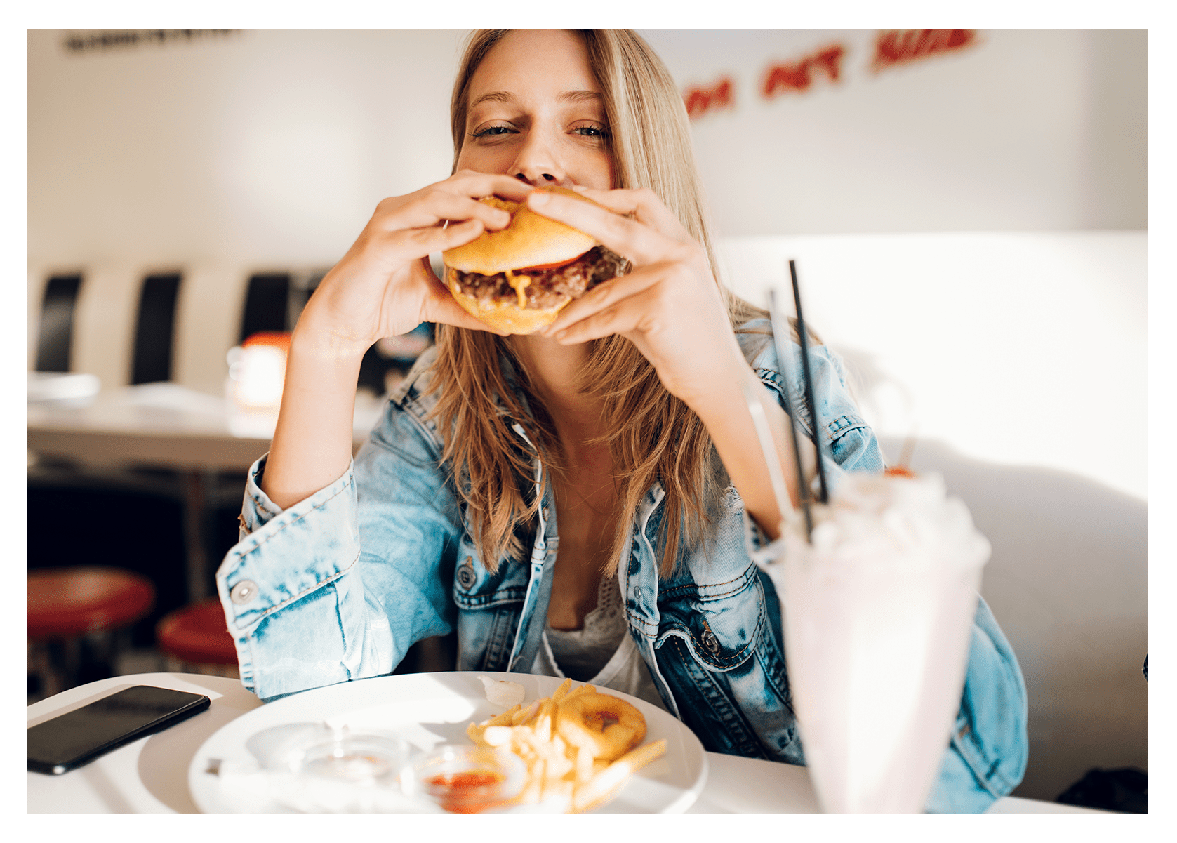 Resident enjoying a tasty burger and shake near The Wayland in St Petersburg, Florida