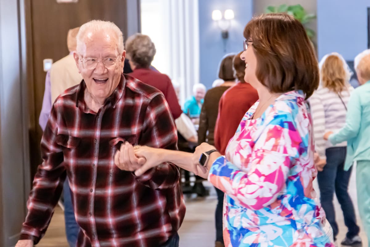 Resident dancing at Watermere at Flower Mound in Flower Mound, Texas.