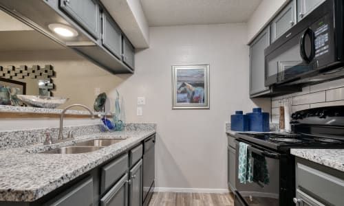 An apartment kitchen at Villas de Santa Fe in San Antonio, Texas