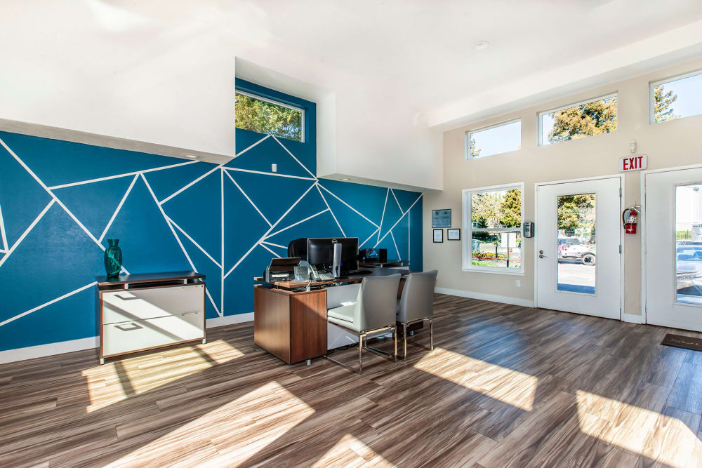 Inside of the sunlit clubhouse at Bennington Apartments in Fairfield, California