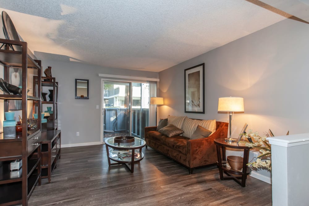 Spacious living room with hardwood-style flooring at Avery Park Apartments in Fairfield, California
