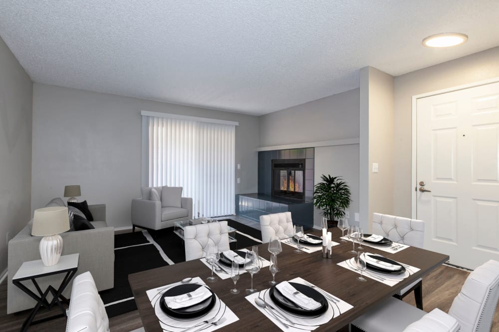 Spacious living room with a fireplace and hardwood-style floors at Bennington Apartments in Fairfield, California