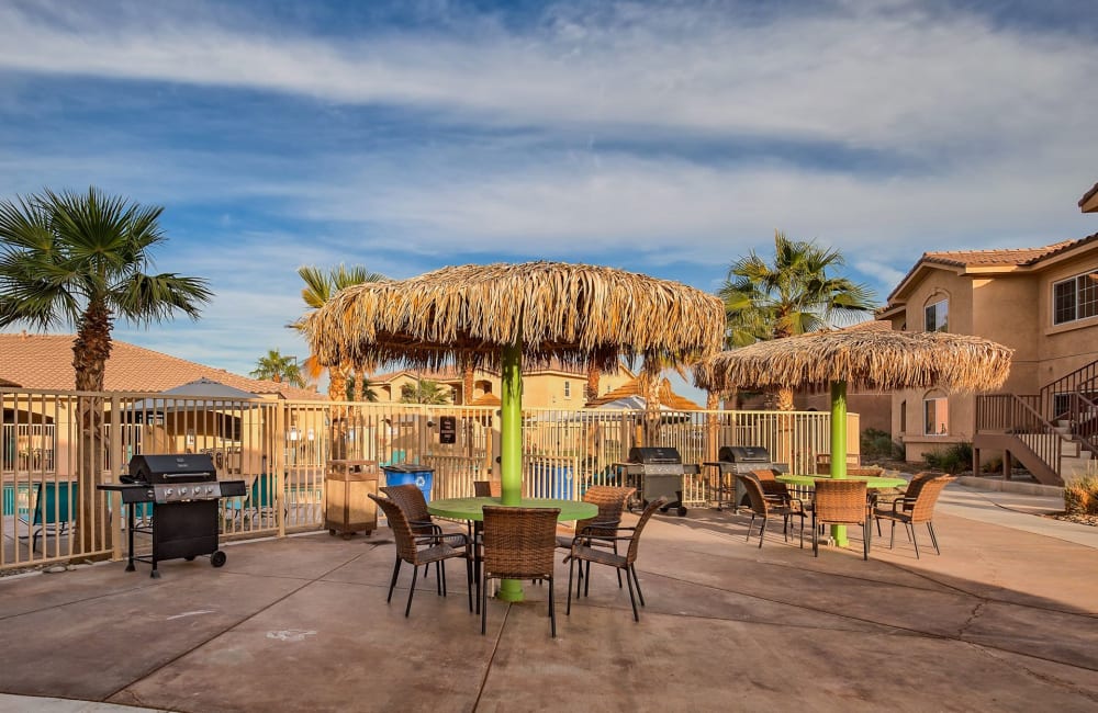 Luxury patio and seating near pool at  Miraflores Apartments in El Centro, California