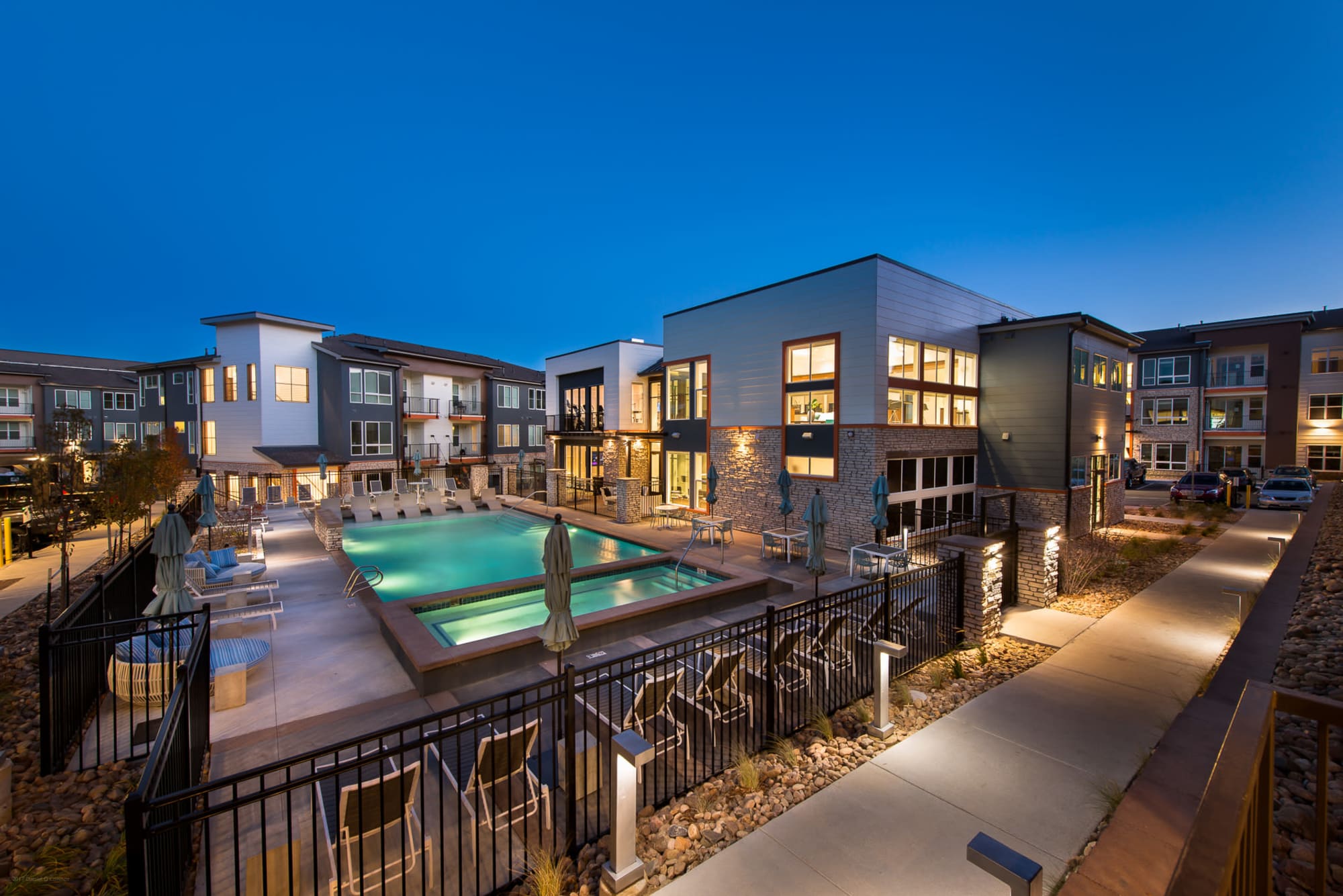 View of the pool at dusk at Elevate in Englewood, Colorado