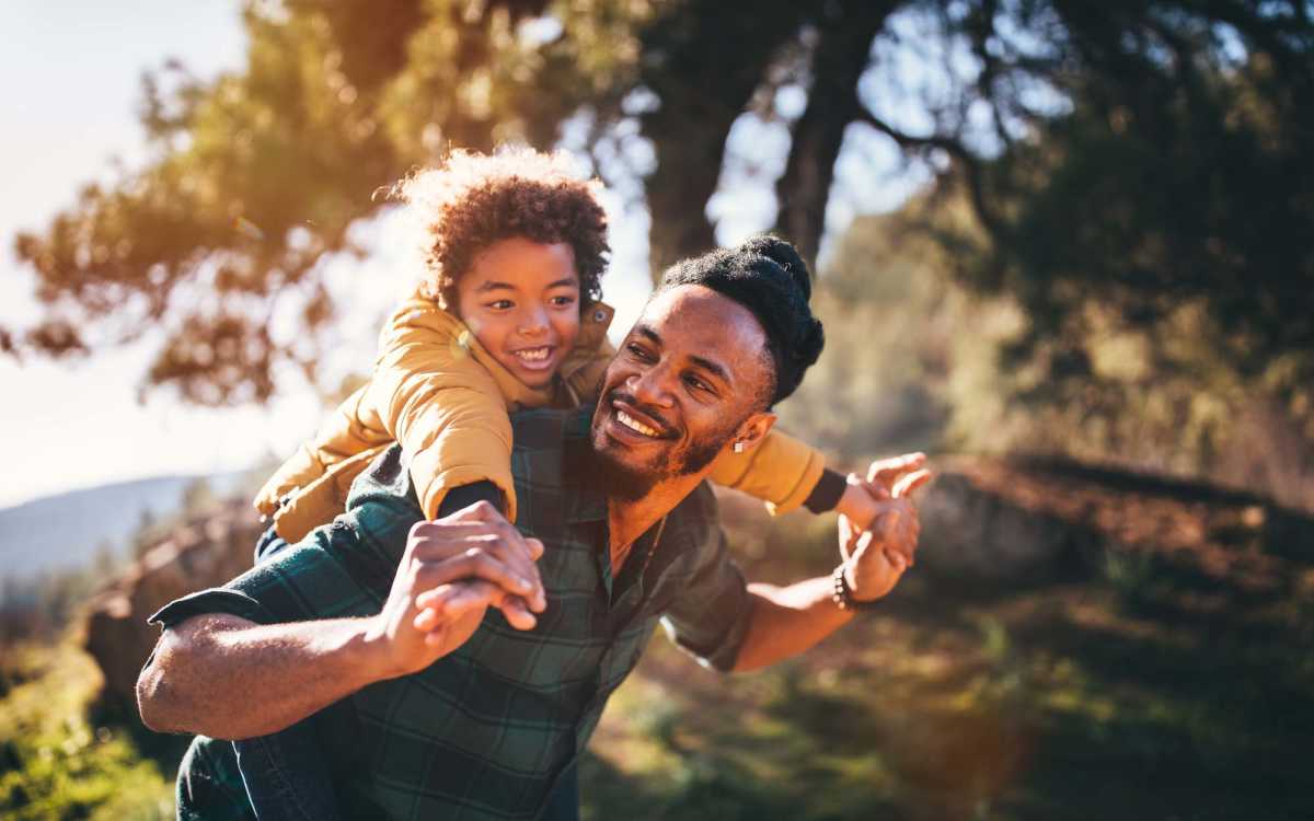 Resident with his kid in the park near Landmark Apartments in Chesapeake, Virginia