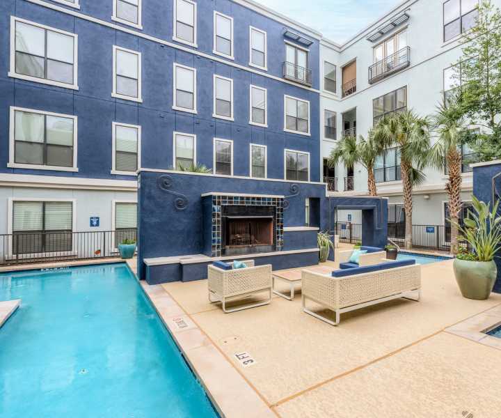 Swimming pool and firepit lounge area at Briar Forest Lofts in Houston, Texas